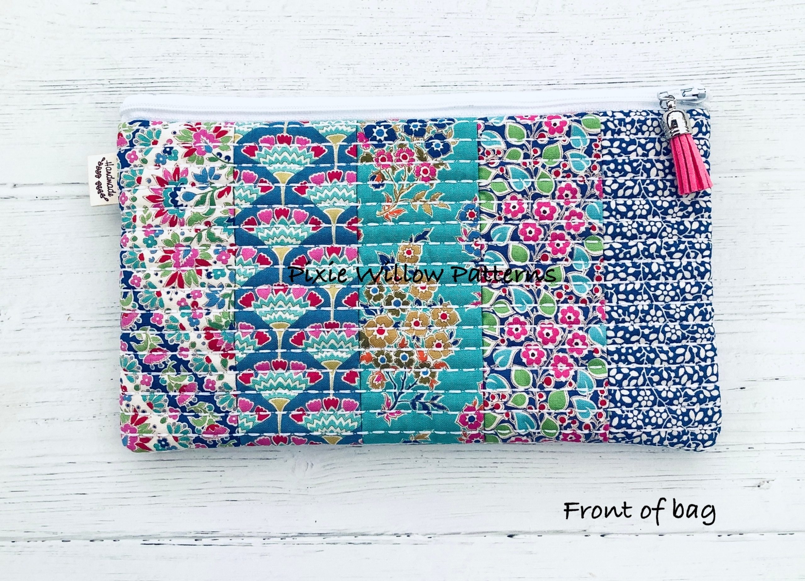 Embroidery machine design of a zipper pouch with vertical quilted ...